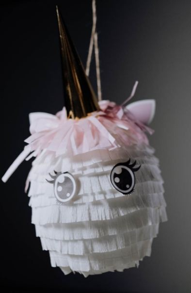 Prop of a unicorn with a golden horn. 