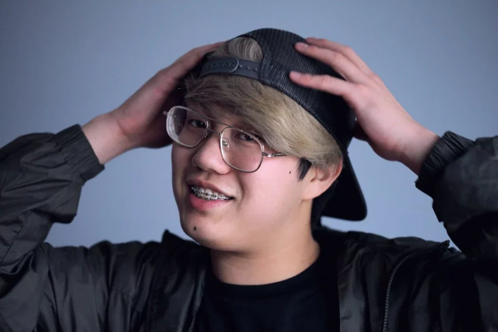 A smiling man with braces