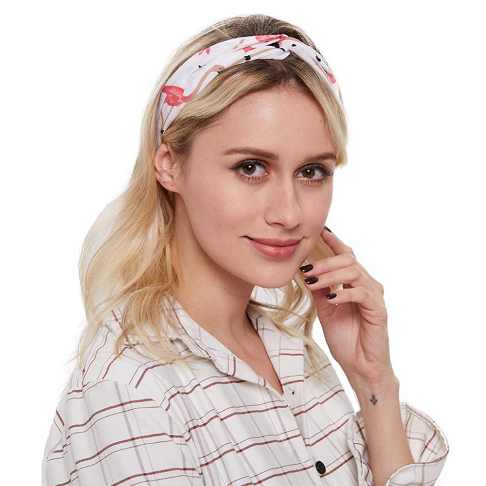a girl wearing a headband with flamingoes printed on it