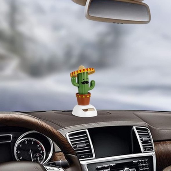 A cactus-shaped dashboard doll
