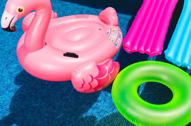 pink flamingo inflatable on swimming pool