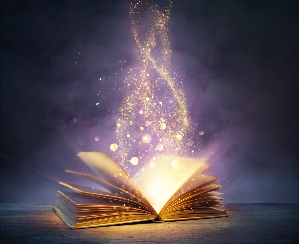 gold dust swirling up from the pages of an open book
